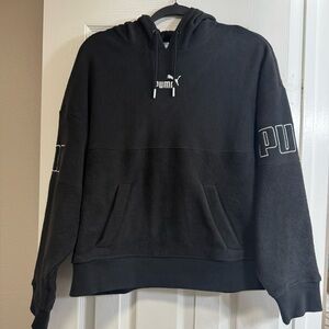 Puma black shorty hoodie. PUMA on both sleeves. Front pocket. Large NWOT